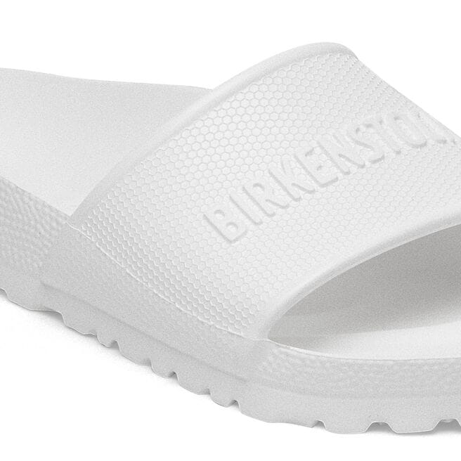 White Birkenstock Barbados EVA slide sandal with textured strap and molded footbed