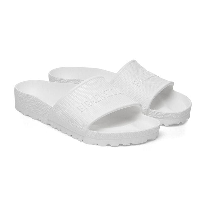 White Birkenstock Barbados EVA slide sandals with embossed logo on clean background