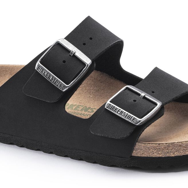 Black Birkenstock Arizona sandals with two adjustable buckle straps on white background