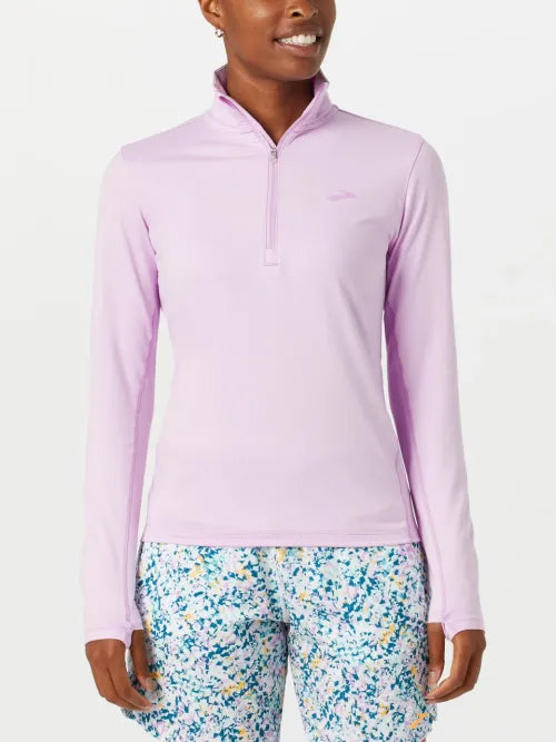 Brooks Dash 1/2 Zip 2.0 pullover in light orchid purple on female model