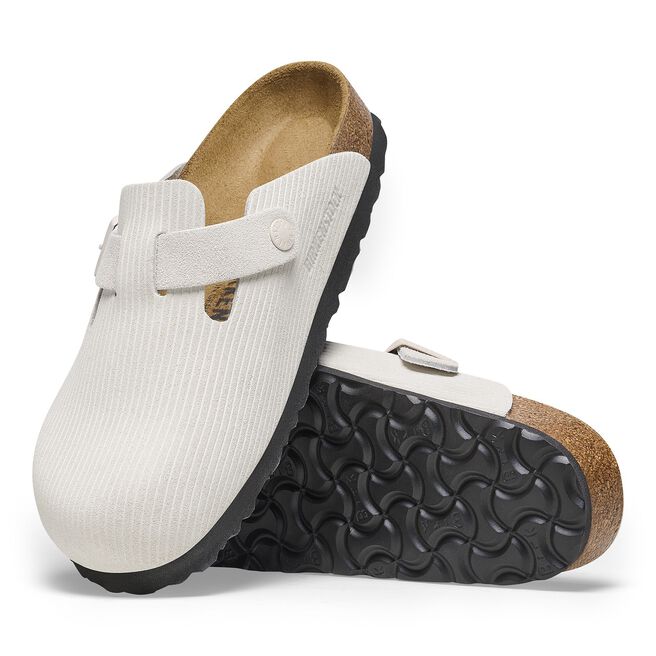 Birkenstock Boston clogs in white corduroy texture with adjustable strap and cork footbed