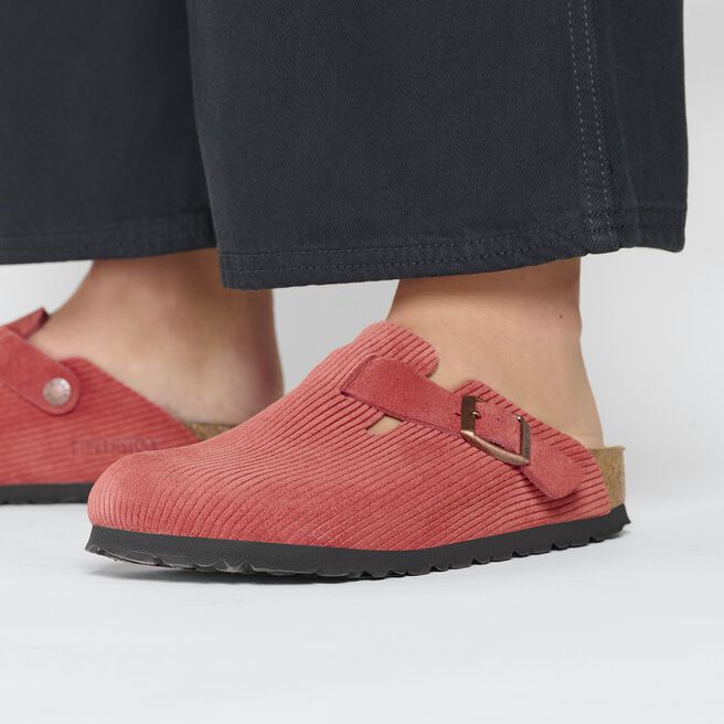 Birkenstock Boston clogs in coral red corduroy with adjustable strap and cork sole