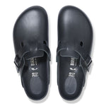 Black Birkenstock Boston clogs with adjustable strap, top view studio shot
