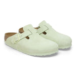 Birkenstock Boston clogs in faded lime green suede with adjustable buckle strap
