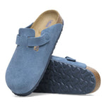 Birkenstock Boston clogs in light blue suede with adjustable strap and cork footbed