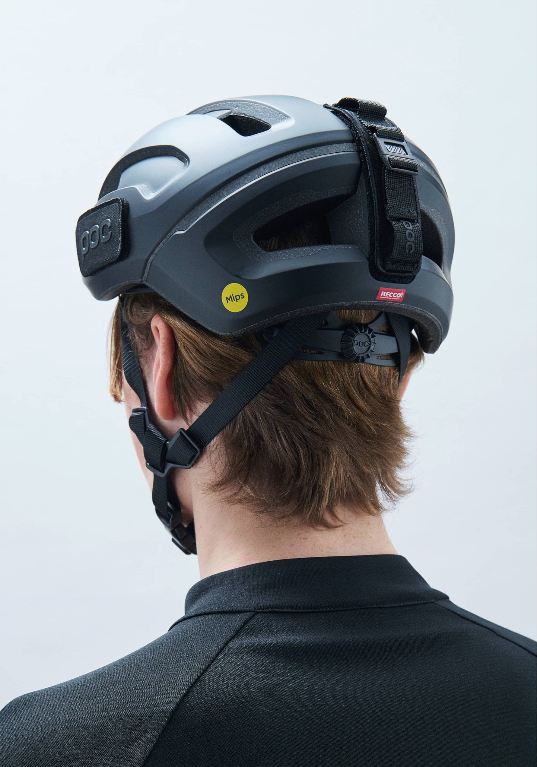 POC Omne Ultra MIPS bike helmet in uranium black matte worn by model