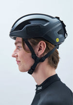 POC Omne Ultra MIPS cycling helmet in dark matte finish worn by model