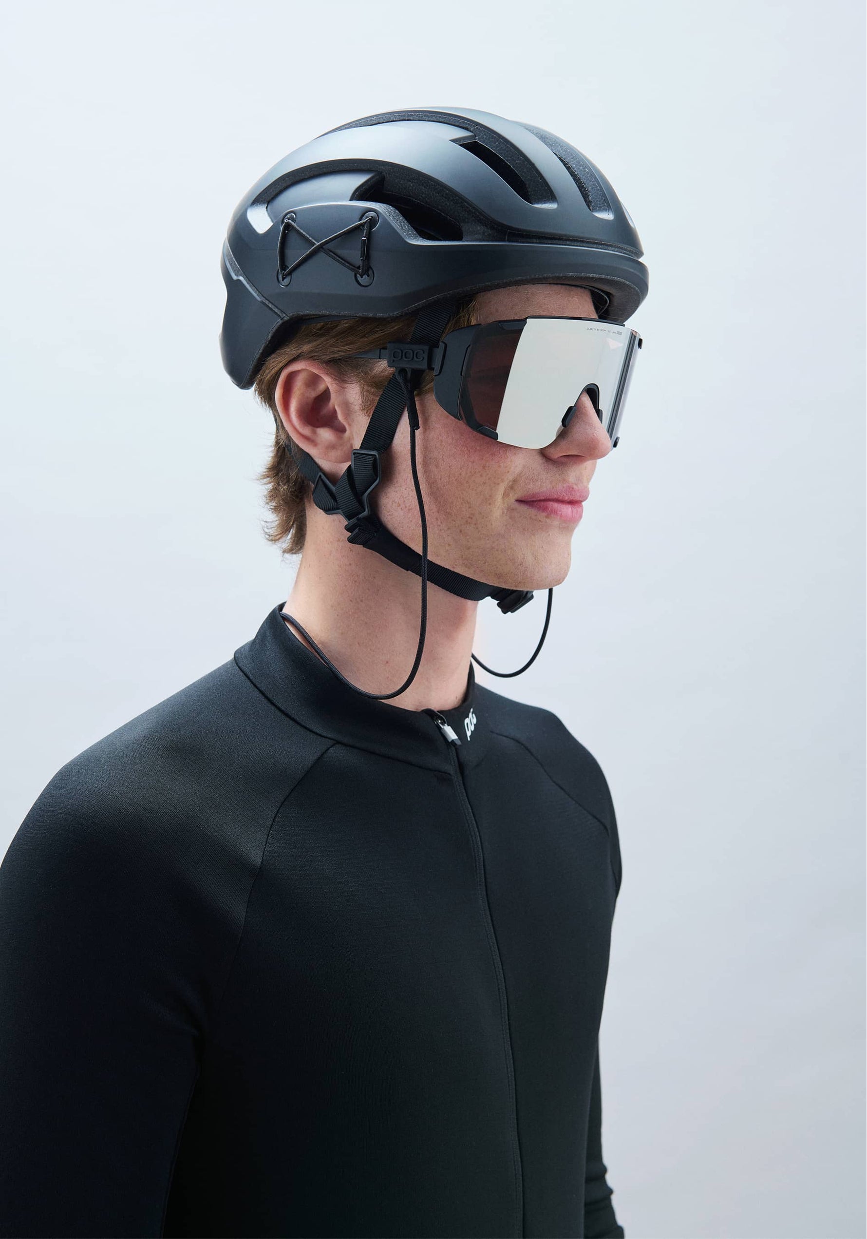 POC Omne Ultra MIPS cycling helmet in Uranium Black Matt with integrated sunglasses