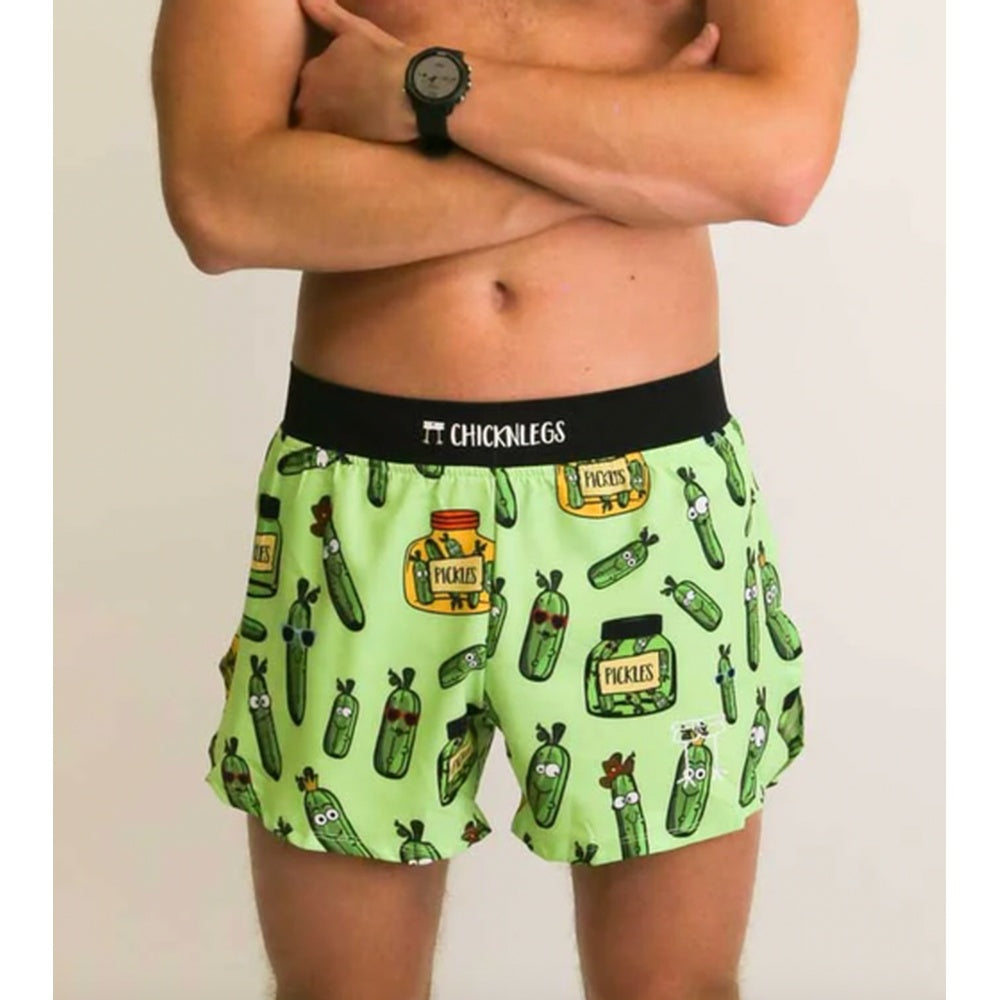 Man wearing green ChicknLegs half split shorts with pickle and jar pattern