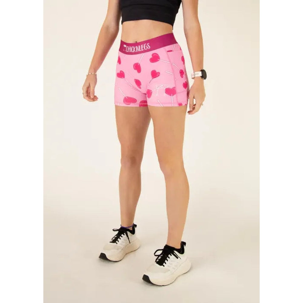 ChicknLegs pink compression shorts with heart pattern and brand waistband on model