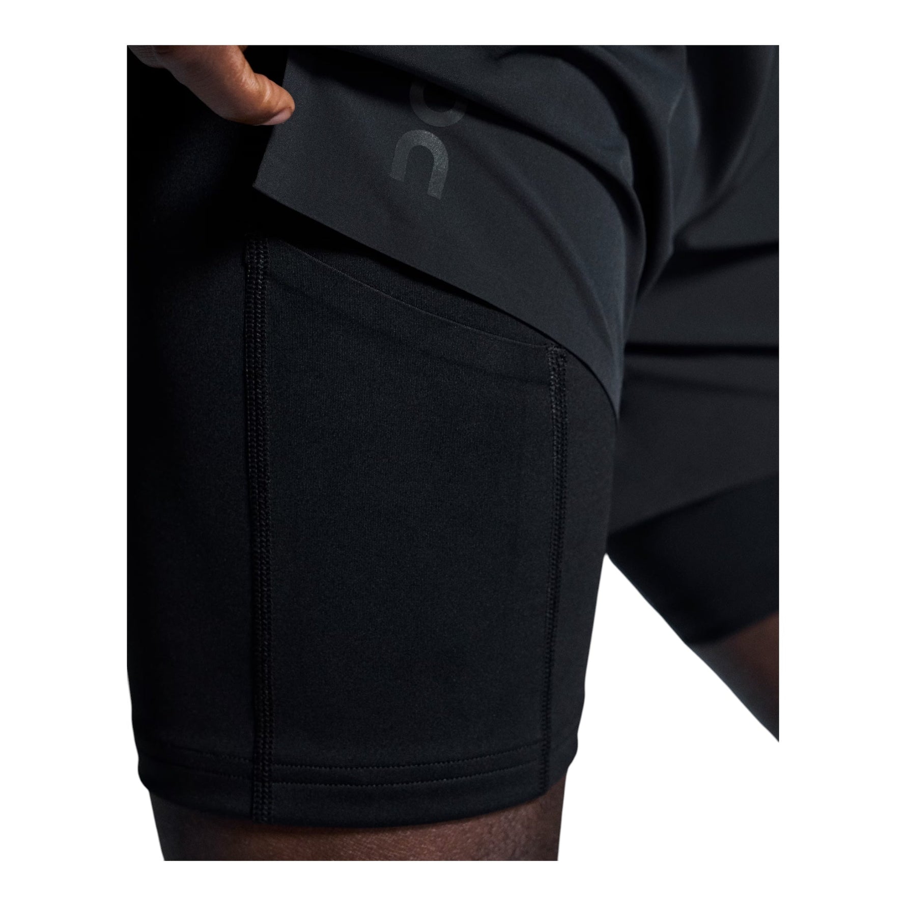 On Performance 2/1 Shorts in black showing waistband detail and athletic fit