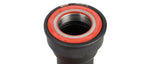 Close-up of SRAM GXP BB86 bottom bracket end showing red sealed bearing and inner race