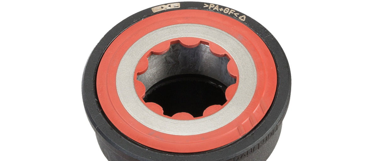 Front face view of SRAM GXP BB86 bottom bracket showing splined inner bore and red sealed bearing