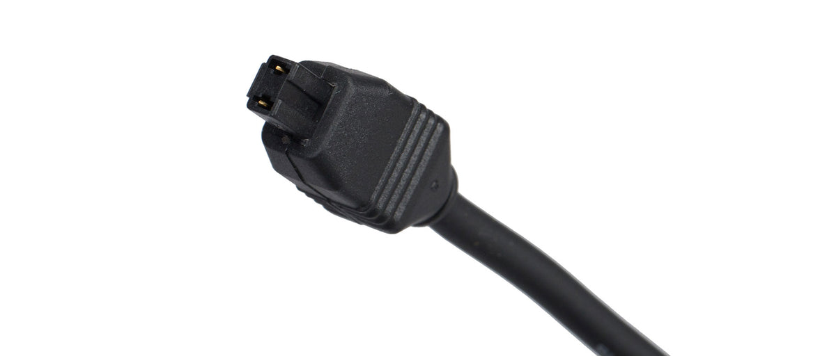 Close-up of Shimano Di2 charger proprietary connector plug end on black cable