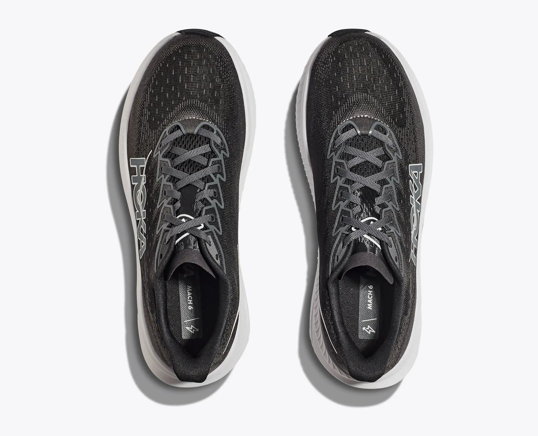 Hoka Mach 6 running shoes in dark gray and black colorway, top view