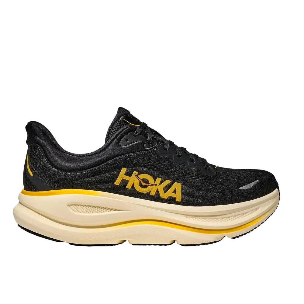 Hoka running shoe in black with yellow branding and cream midsole