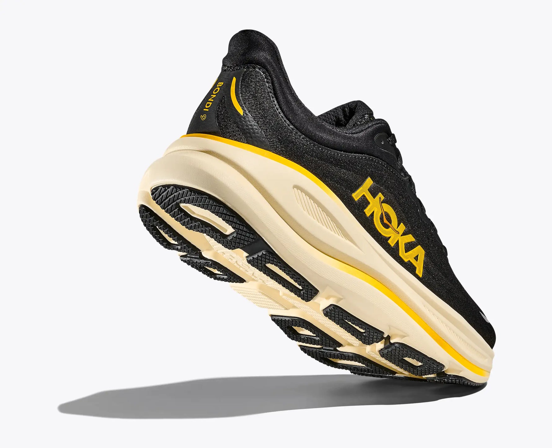 Hoka Bondi 9 running shoe in black with yellow branding and cream midsole