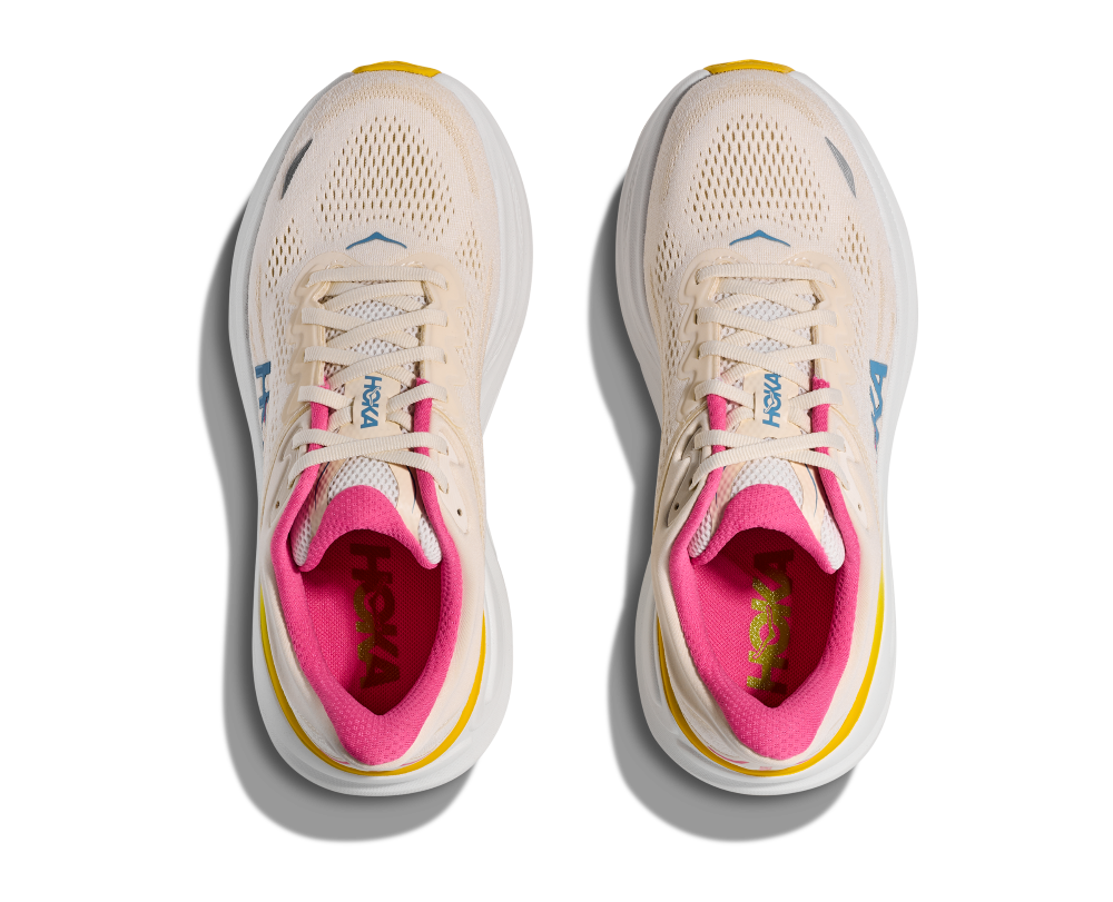 HOKA women's running shoes in alabaster beige with pink interior lining