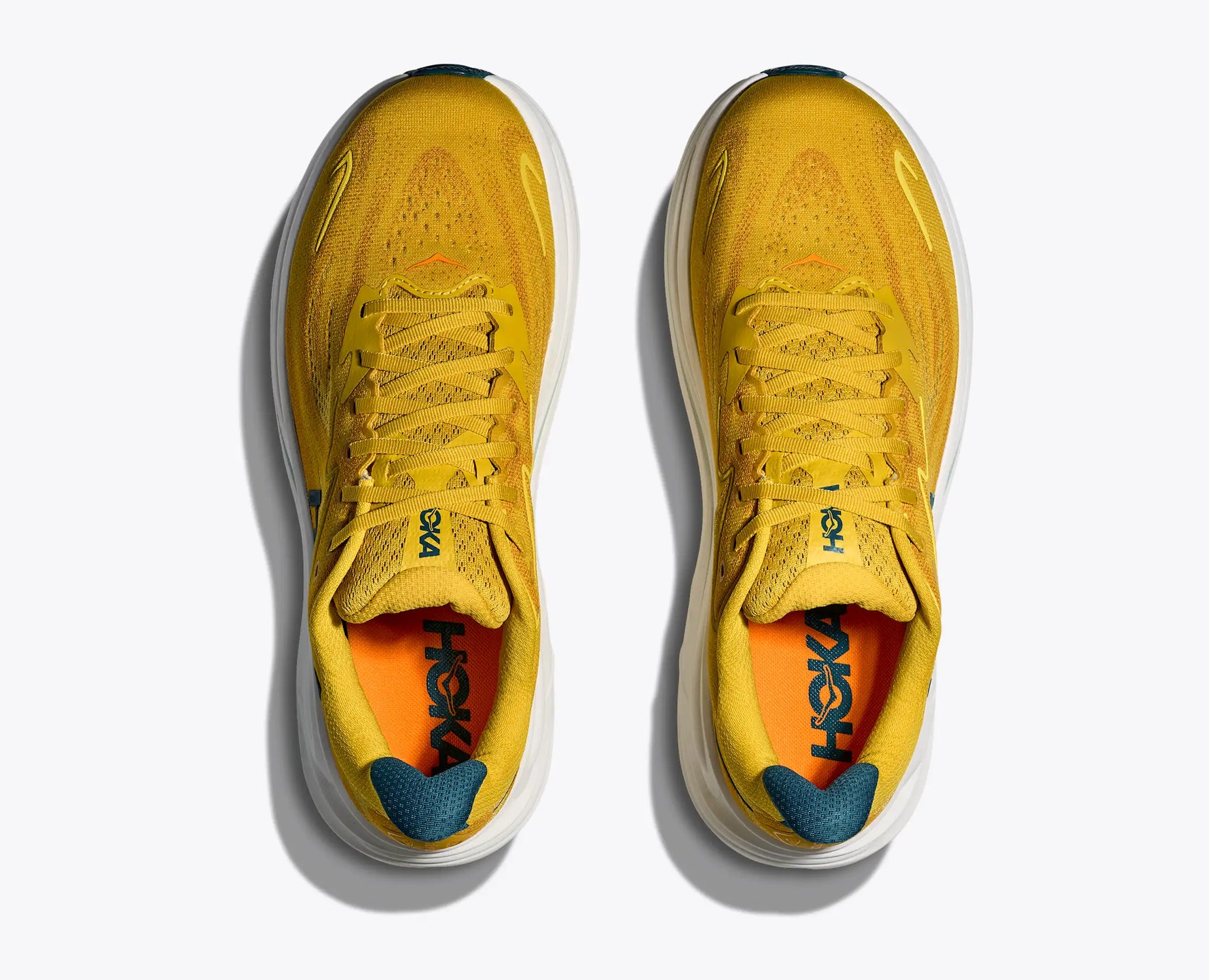 Hoka Clifton 10 men's running shoes in yellow gold with teal accents
