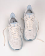 Pair of Hoka Clifton 10 women's running shoes in grout and mineral blue colorway