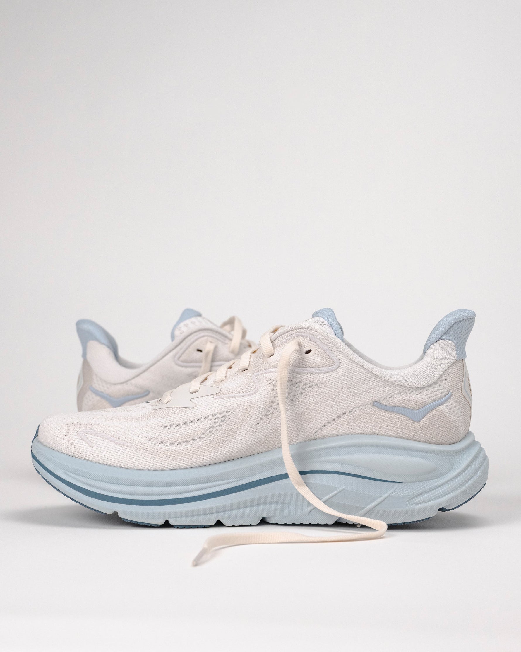 Hoka Clifton 10 women's running shoes in grout and mineral blue colorway