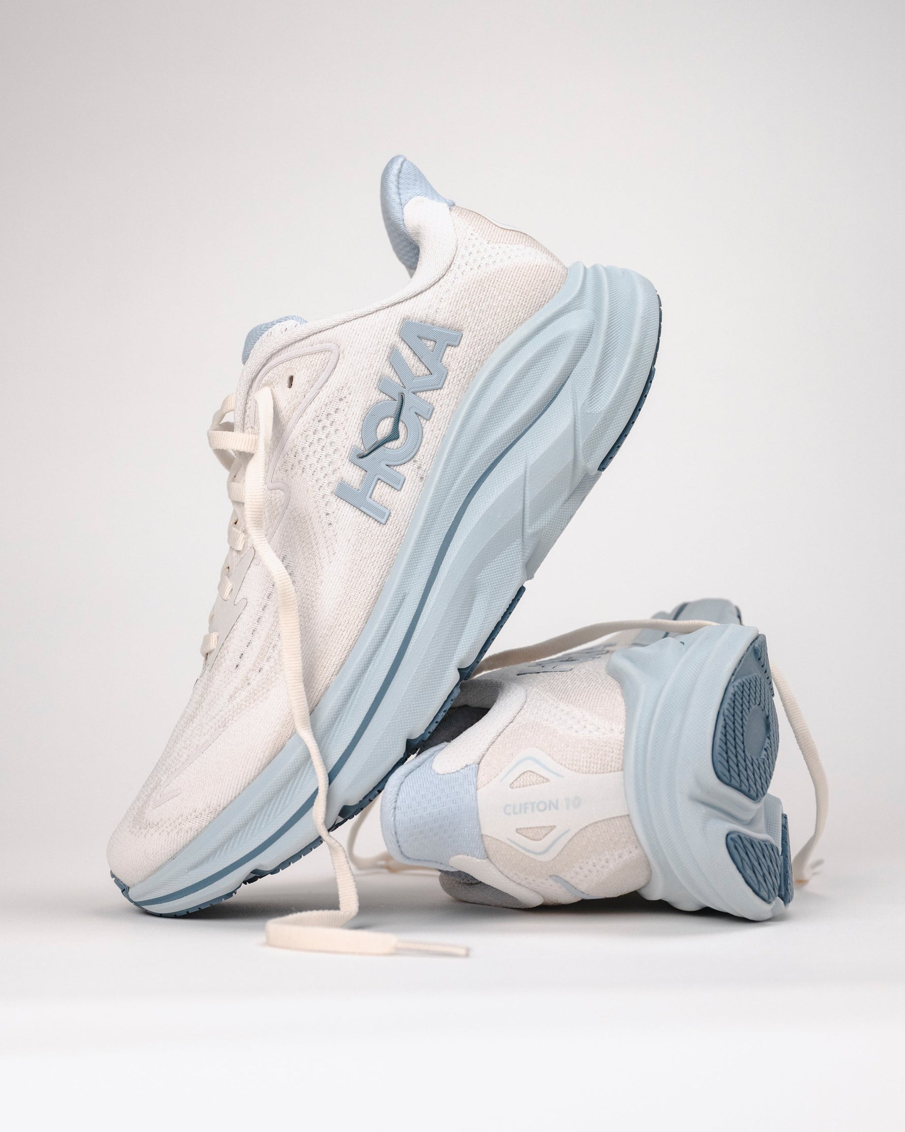 Hoka Clifton 10 women's running shoes in grout and mineral blue colorway