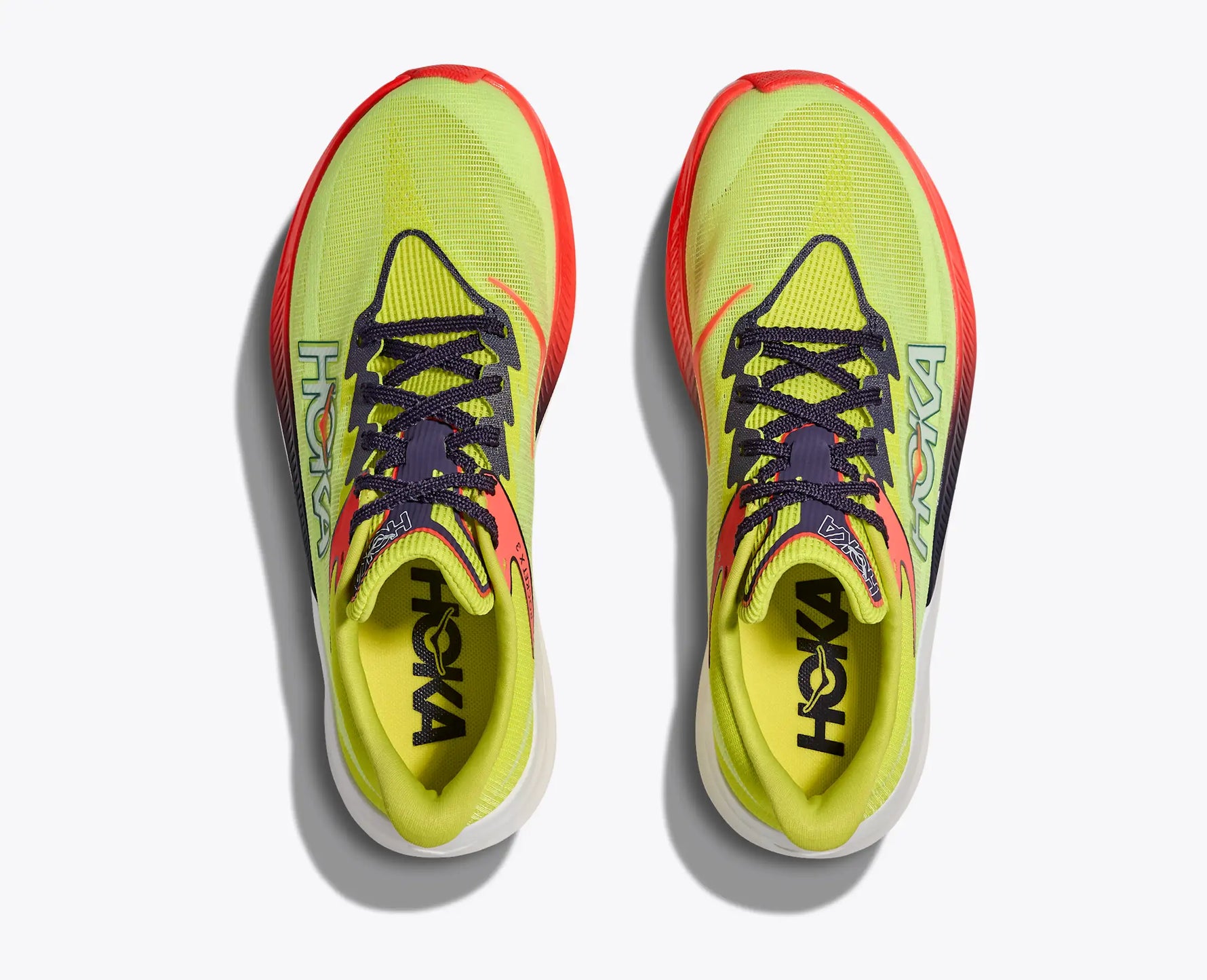 Hoka Rocket X 3 running shoes in bright yellow-green with red accents, top view