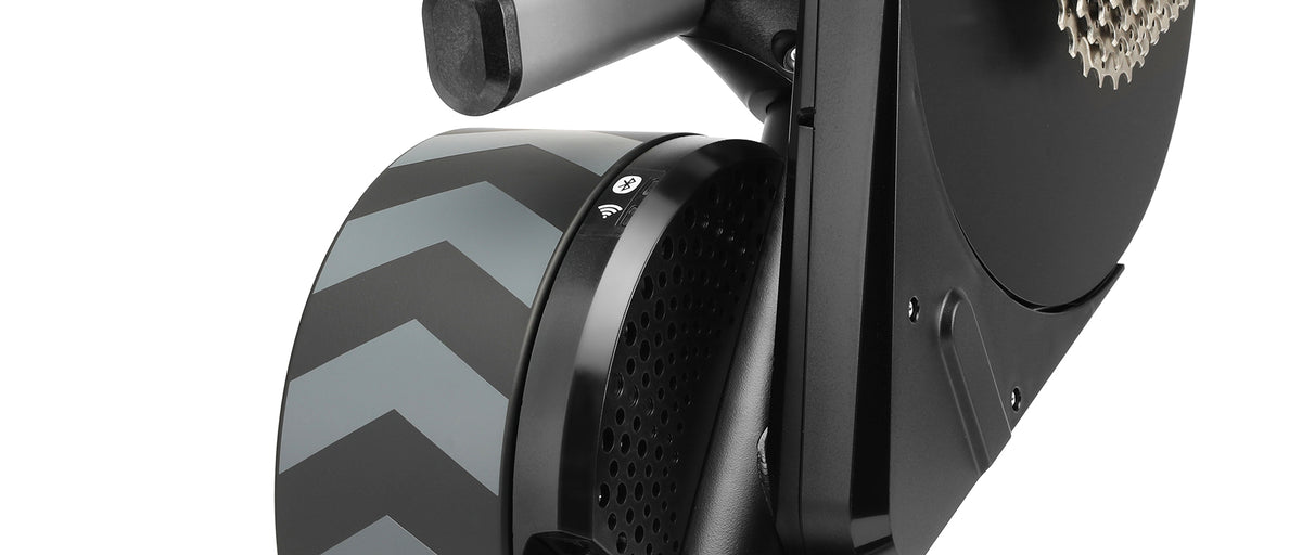 Close-up of Wahoo KICKR trainer flywheel showing Bluetooth and WiFi connectivity icons