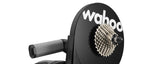 Close-up of Wahoo KICKR trainer rear showing cassette and Wahoo logo on flywheel