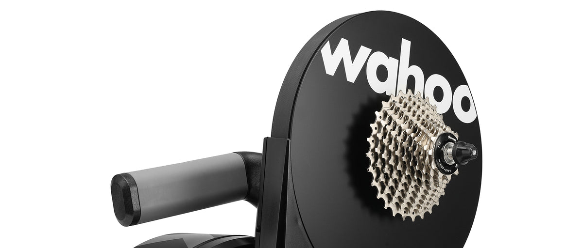 Close-up of Wahoo KICKR trainer rear showing cassette and Wahoo logo on flywheel