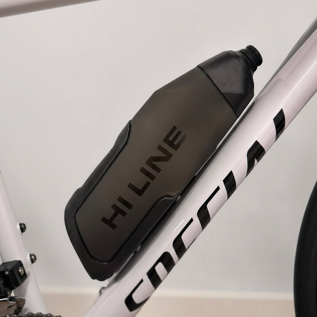 Hi Line Slipstream aero bottle cage mounted on white Cipollini road bike frame close-up