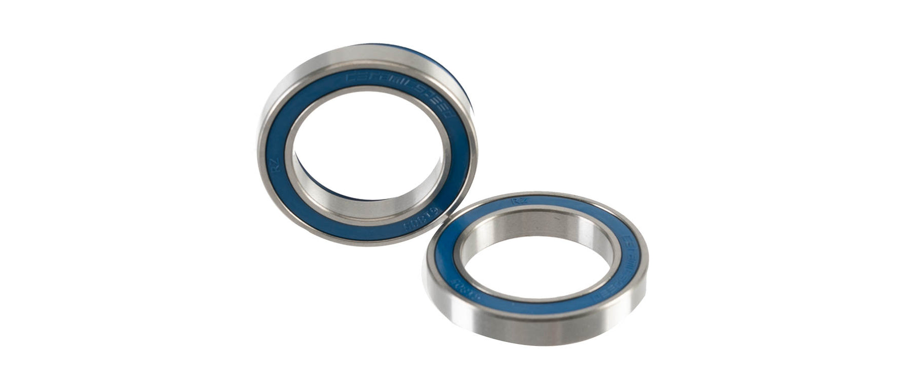 Two CeramicSpeed bottom bracket bearings with blue seals on white background