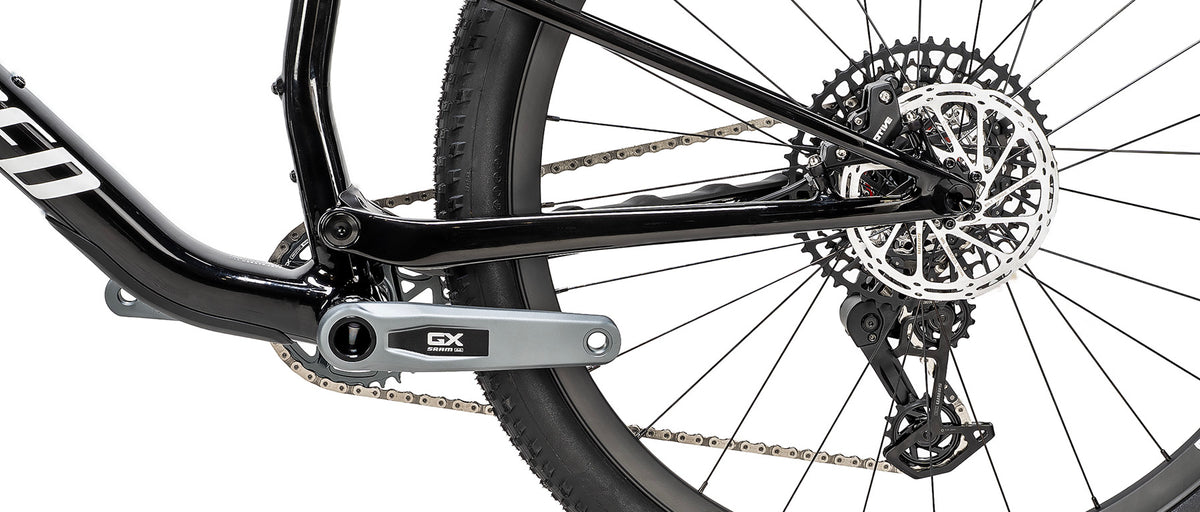 Specialized Epic 9 Expert drivetrain detail showing SRAM GX crankset and rear cassette on gloss black carbon frame
