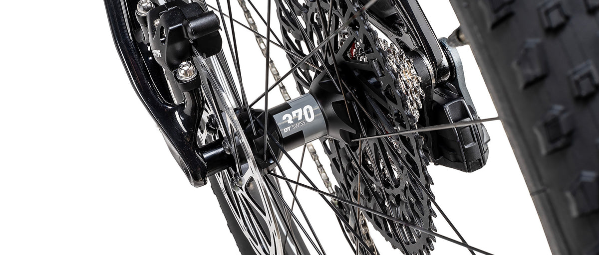 Close-up of DT Swiss 370 rear hub with SRAM cassette and derailleur on Specialized Epic 9 Expert mountain bike