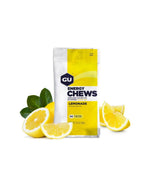 GU Energy Chews Lemonade 60g packet with sliced lemons on white background