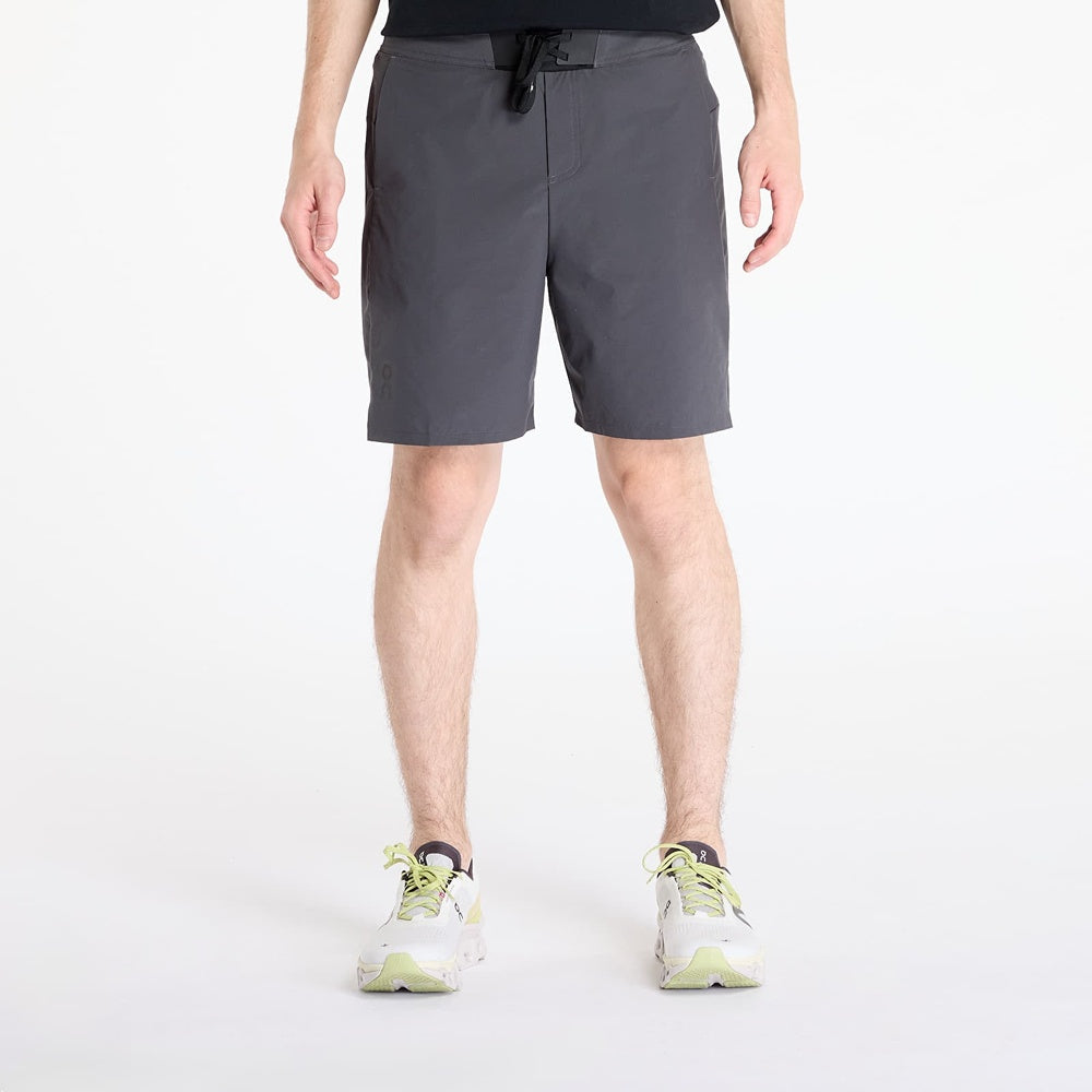 On Performance Hybrid Shorts in shadow gray worn by model on white background