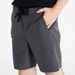Man wearing On Performance Hybrid Shorts in shadow gray with drawstring waistband