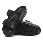 Black Birkenstock Arizona Essentials EVA sandals with adjustable straps on white background