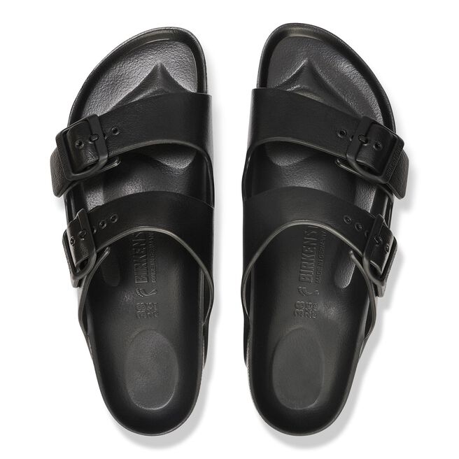 Black Birkenstock Arizona Essentials EVA sandals with two adjustable straps on white background