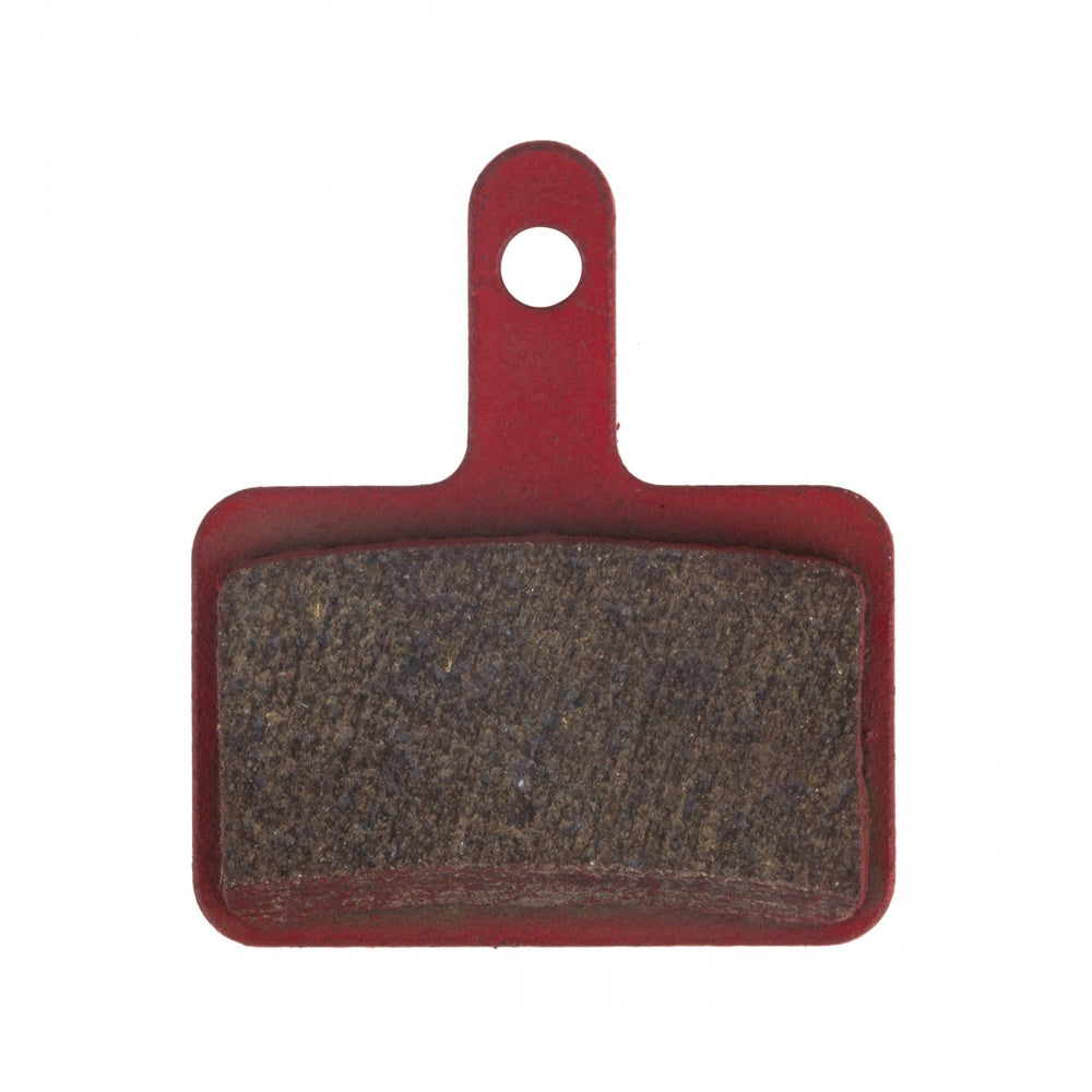 Kool-Stop disc brake pad with red backing plate and brown friction material