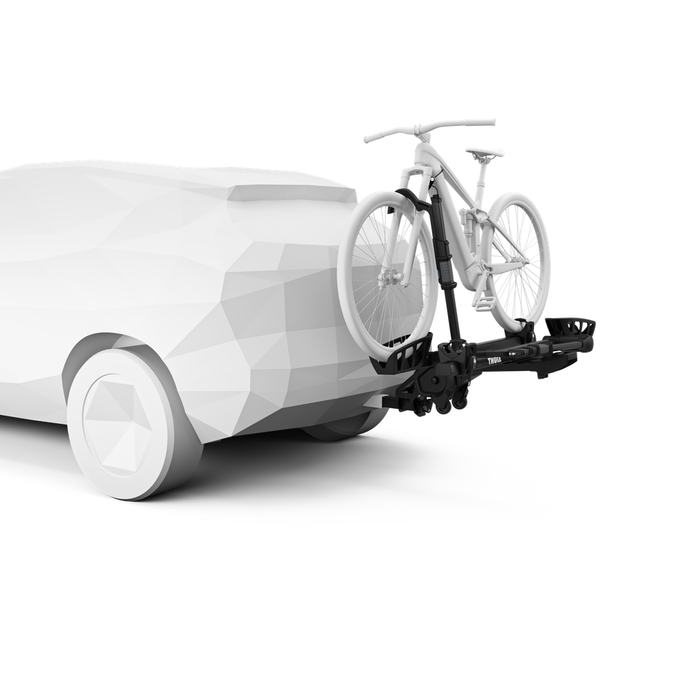 Thule T2 Pro XT bike rack attached to vehicle hitch holding white bicycle