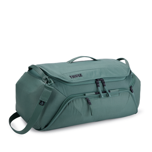 Thule Roundtrip bike duffel bag in hazy green with multiple compartments and straps