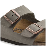 Birkenstock Arizona sandals in stone gray with copper buckles on white background
