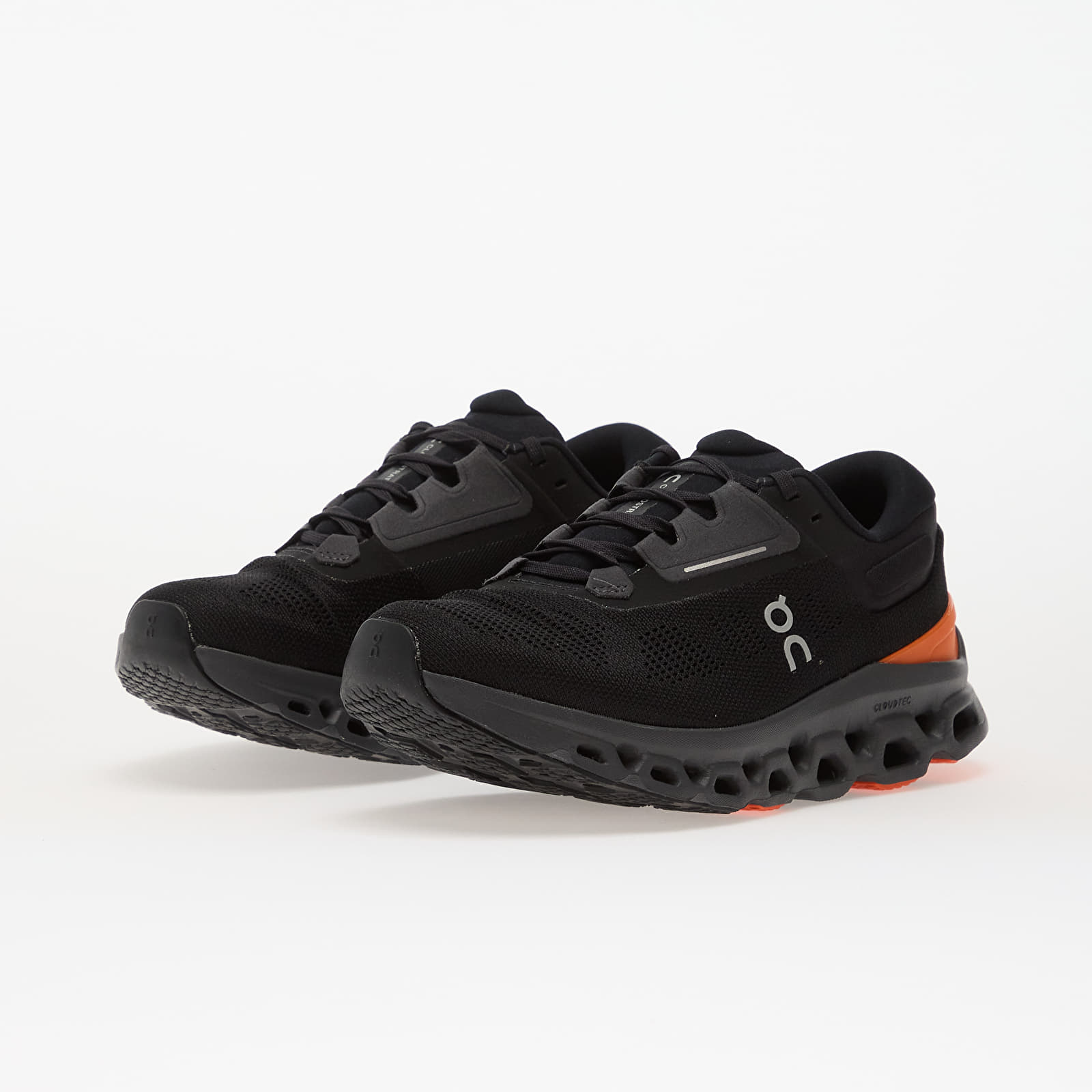 On Cloudstratus 3 running shoes in black with orange flame accents