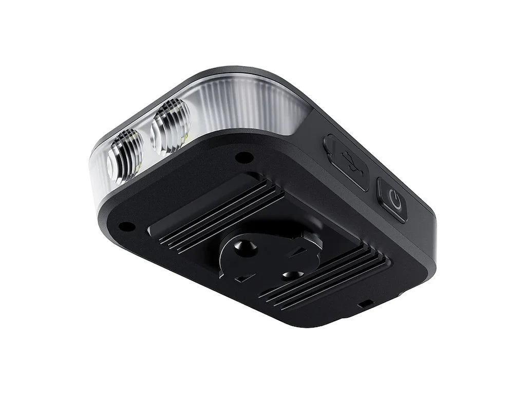 Ravemen FR1100 bike light bottom view showing dual LED lenses and mounting interface