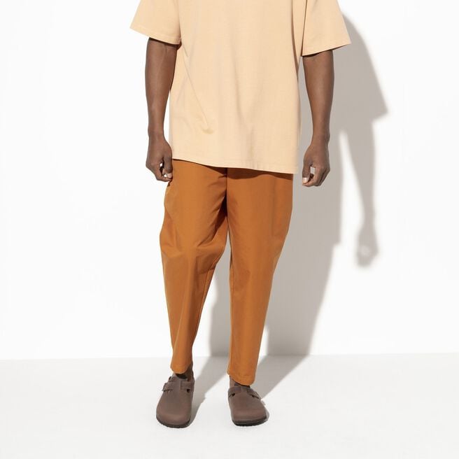 Model wearing Birkenstock Boston clogs in Habana brown oiled leather
