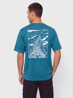 Man showing back of Patagonia Capilene Cool Daily Shirt in glacial blue with mountain peak graphic