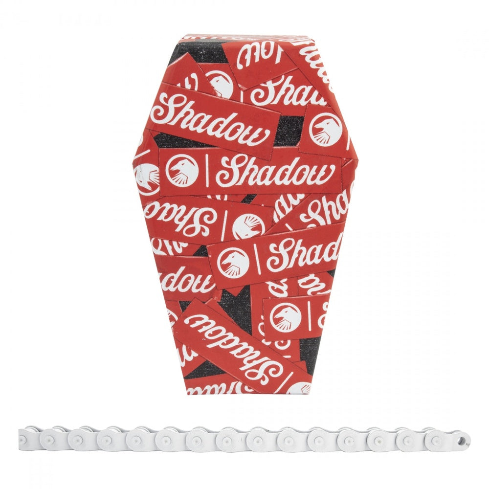 The Shadow Conspiracy white bicycle chain with red branded packaging displayed on clean background
