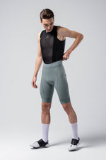 Male cyclist wearing Gobik Matt 2.0 bib shorts in sage green trooper color