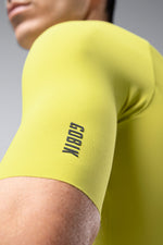 Close-up of bright yellow Gobik cycling jersey sleeve showing brand text